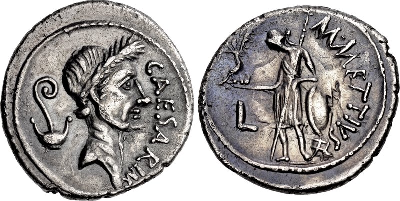Anverso y reverso de una moneda romana de plata (denario) del 44 a. C., mostrando el perfil laureado de Julio César en un lado y a la diosa Venus en el reverso.